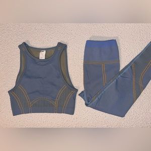 Fabletics seamless low impact open back bra high waisted compressive leggings.